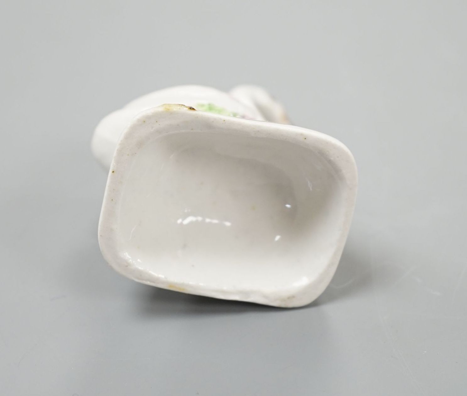 A Staffordshire porcelain model of a swan, c.1835-50, on a mound base, 5.4 cm high, Provenance: Dennis G.Rice collection